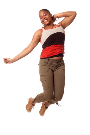 Casual young woman jumping. Studio shot over white.の写真素材