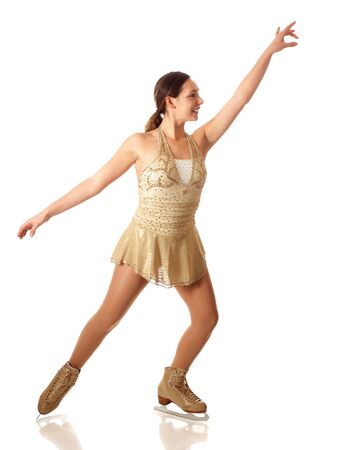 Young adult figure skater. Studio shot over white.の写真素材