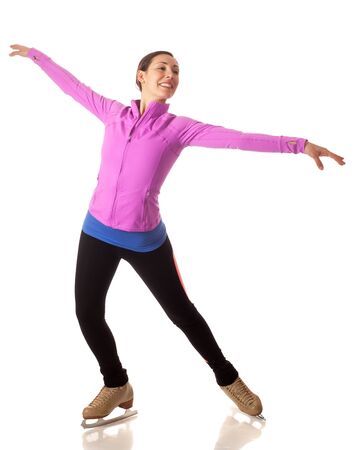 Young adult figure skater. Studio shot over white.の写真素材