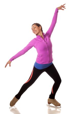 Young adult figure skater. Studio shot over white.の写真素材