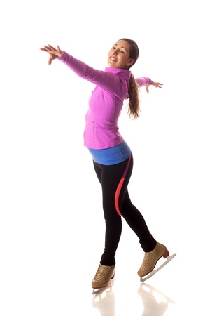 Young adult figure skater. Studio shot over white.の写真素材