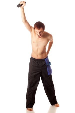 Young adult male swimmer cheering on teammates. Studio shot over white.の写真素材