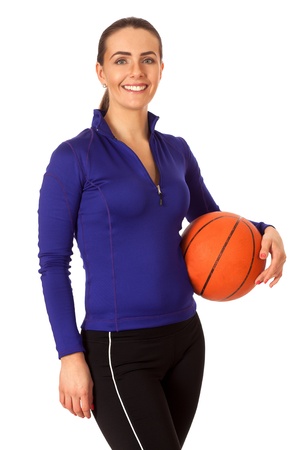 Adult woman with basketball. Studio shot over white.の写真素材