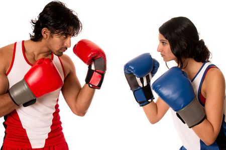 Male and female boxers "Battle of the sexes". Studio shot over white.の写真素材