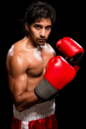 Male boxer in red. Studio shot over black.の写真素材