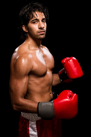 Male boxer in red. Studio shot over black.の写真素材
