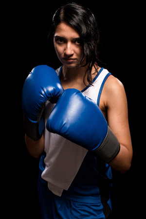 Female boxer in blue. Studio shot over white.の写真素材