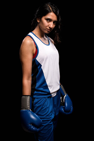 Female boxer in blue. Studio shot over white.の写真素材
