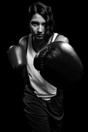 Female boxer  Studio shot over white の写真素材