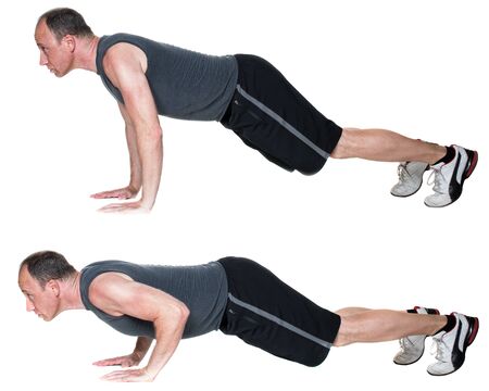Push up exercise. Studio shot over white.