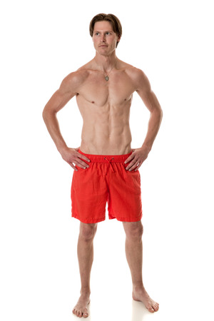 Man in swimwear. Studio shot over white.の写真素材