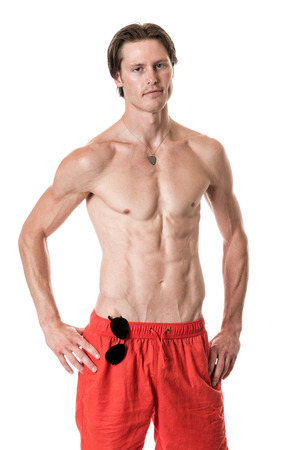 Man in swimwear. Studio shot over white.の写真素材