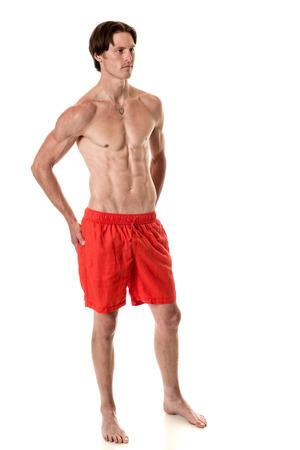 Man in swimwear. Studio shot over white.の写真素材