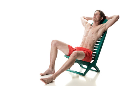 Man in swimwear. Studio shot over white.の写真素材