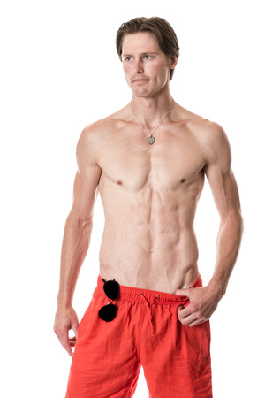 Man in swimwear. Studio shot over white.の写真素材
