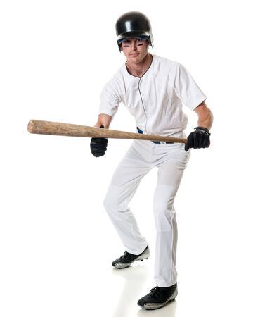 Young adult baseball player. Studio shot over white.の写真素材