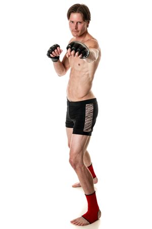 Young adult martial artist. Studio shot over white.の写真素材