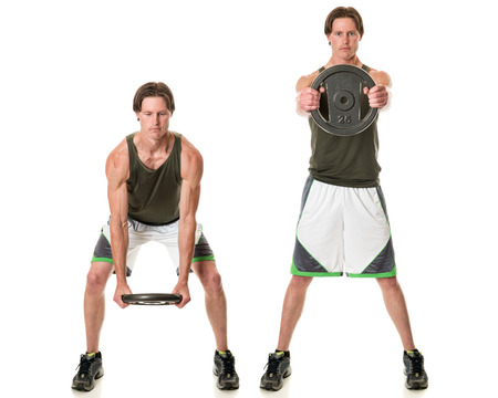 Kettle plate swing exercise. Studio shot over white.の写真素材
