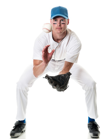 Young adult baseball player. Studio shot over white.の写真素材