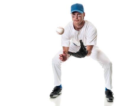 Young adult baseball player. Studio shot over white.の写真素材