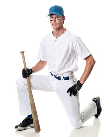Young adult baseball player. Studio shot over white.の写真素材