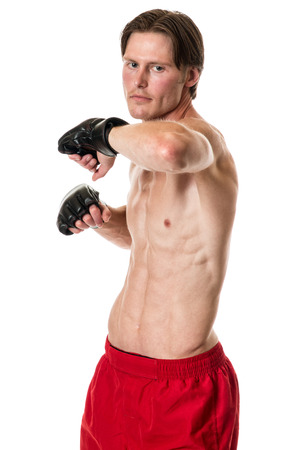 Young adult martial artist. Studio shot over white.の写真素材
