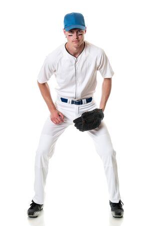 Young adult baseball player. Studio shot over white.の写真素材