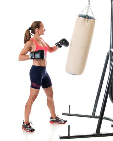 Heavy bag exercise. Studio shot over white.の写真素材