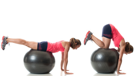 Stability ball exercise. Studio shot over white.の写真素材