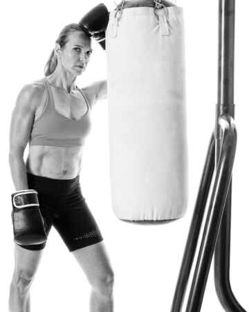 Heavy bag exercise. Studio shot over white.の写真素材