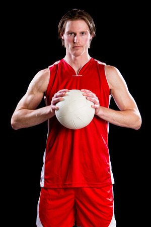 Male volleyball player. Studio shot over black.の写真素材
