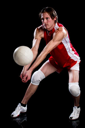 Male volleyball player. Studio shot over black.の写真素材