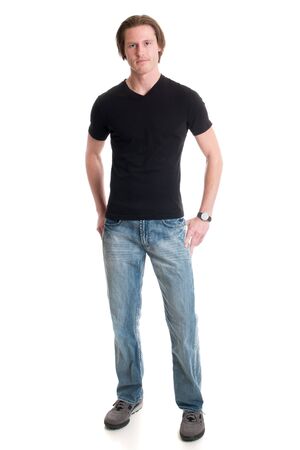 Man in jeans and black tee shirt. Studio shot over white.の写真素材