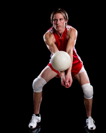 Male volleyball player. Studio shot over black.の写真素材