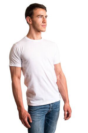 Young man in jeans and tee shirt. Studio shot over white.の写真素材