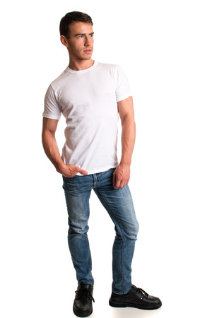 Young man in jeans and tee shirt. Studio shot over white.の写真素材