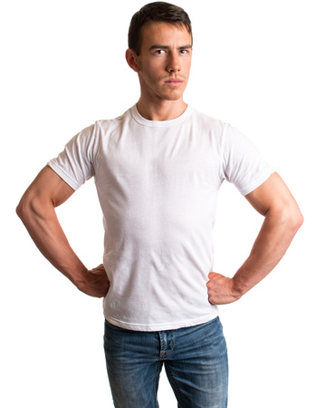 Young man in jeans and tee shirt. Studio shot over white.の写真素材