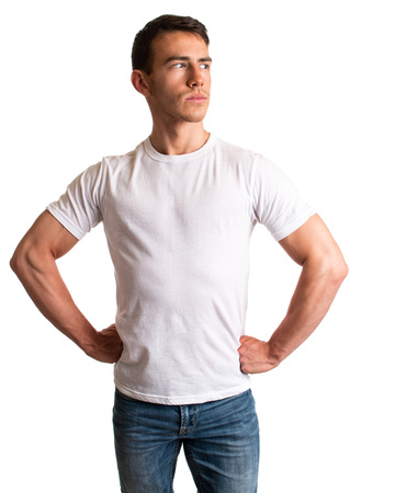 Young man in jeans and tee shirt. Studio shot over white.の写真素材