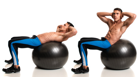 Man exercising with a stability ball. Studio composite over white.の写真素材