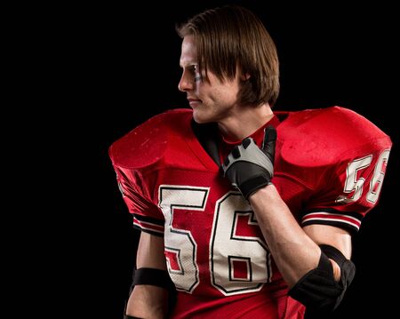 American football player. Studio shot over black.の写真素材