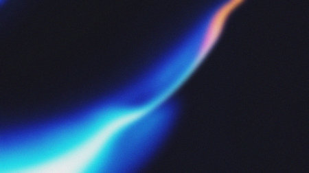 abstract blue and black background with some smooth lines in it.の写真素材