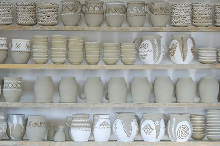 wooden shelf used for drying half processed potteryの写真素材