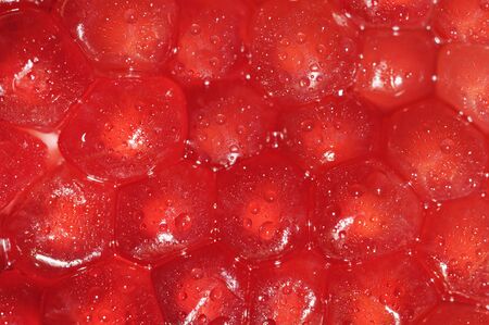 food background with detailed view of fresh pomegranate cellsの写真素材