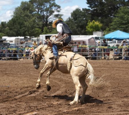 Cowboy rider on a bucking horseの写真素材