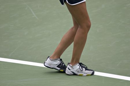 Tennis player's feet positioned for a serveの写真素材