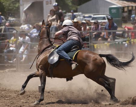 Rider turning a horse aroundの写真素材