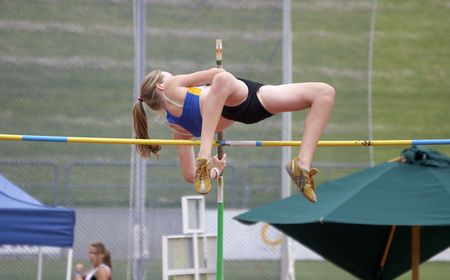Female pole vaulter clearing the barの写真素材