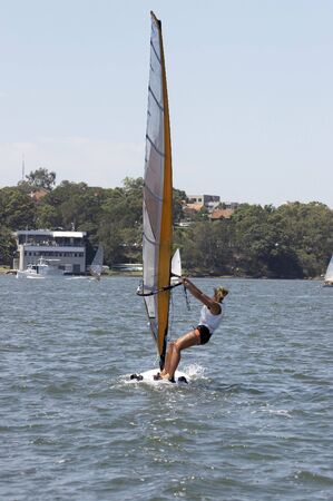 Female Sailboarder on the waterの写真素材