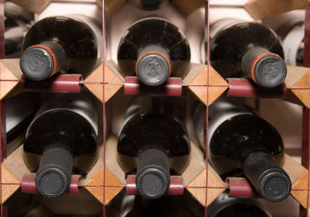 Wine bottles with a bit of dust on themの写真素材