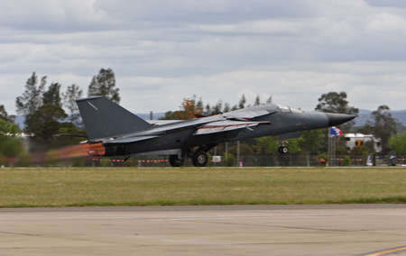Front line jet fighter taking off with afterburners on